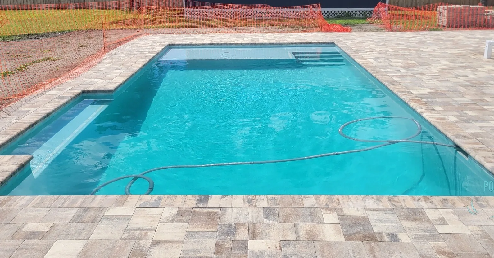 Custom pool with sun shelf and steps built by Scott's Pools & Spas in Jacksonville